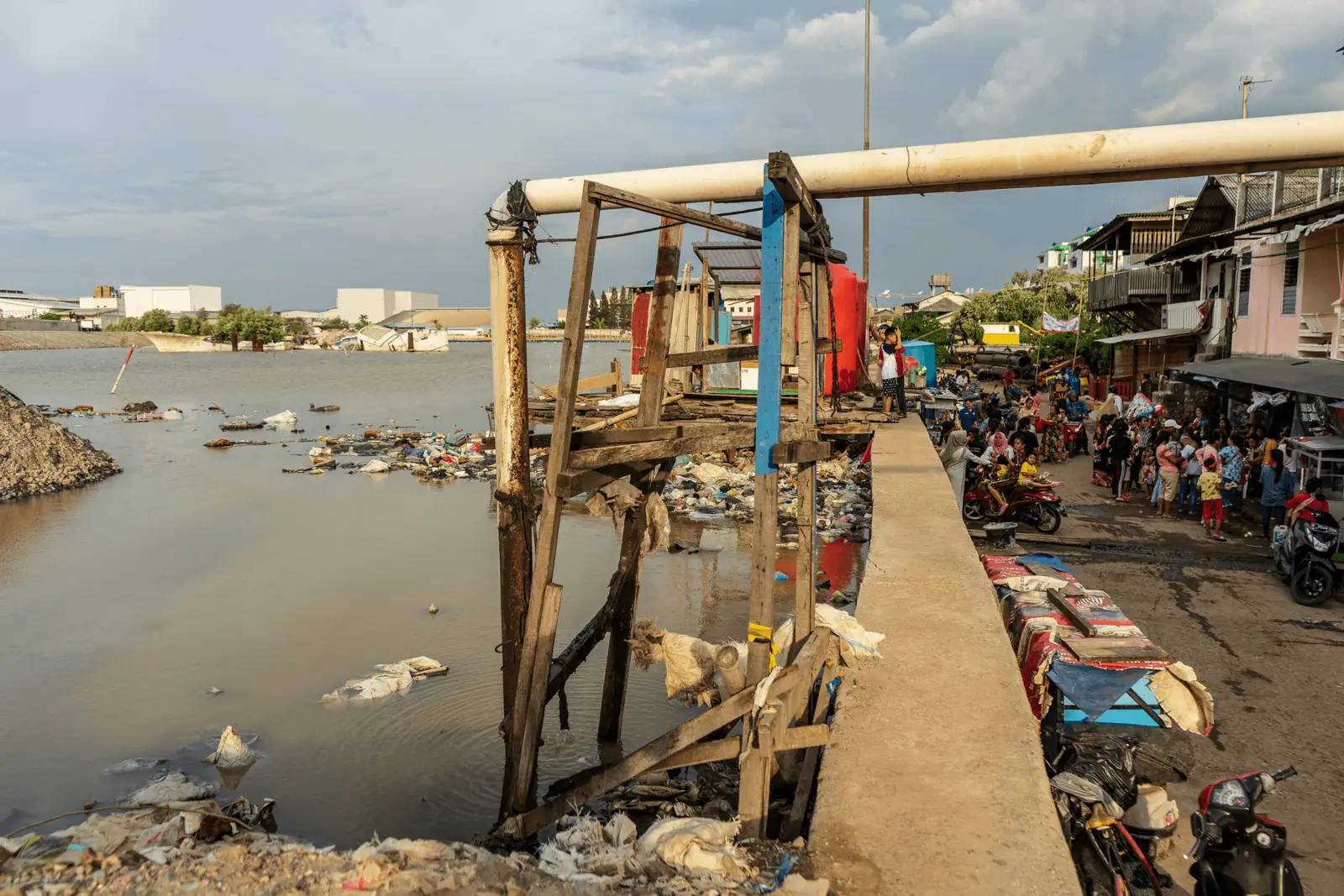 Fishing community dock on polluted water